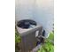 Side view of an air conditioning unit situated next to a light-colored wall at 9748 Derbyhill Cir, Las Vegas, NV 89117