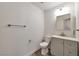 Clean half-bath with modern vanity, sleek fixtures, and wood-look flooring for a fresh aesthetic at 9748 Derbyhill Cir, Las Vegas, NV 89117