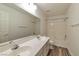 A pristine bathroom features a double sink vanity and a combined shower and tub at 9748 Derbyhill Cir, Las Vegas, NV 89117