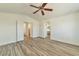 Spacious bedroom featuring vaulted ceilings and wood-look floors at 9748 Derbyhill Cir, Las Vegas, NV 89117