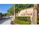 The Ascot Park community sign is surrounded by lush landscaping and mature trees, creating a welcoming entrance at 9748 Derbyhill Cir, Las Vegas, NV 89117