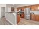 Modern kitchen with stainless steel appliances, granite countertops, and custom cabinetry at 9748 Derbyhill Cir, Las Vegas, NV 89117