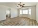 Expansive main bedroom with a nook of bright windows and an en suite bathroom at 9748 Derbyhill Cir, Las Vegas, NV 89117