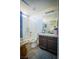 Bathroom with wood cabinets, shower and tub at 10391 Avebury Manor Ln, Las Vegas, NV 89135