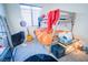 Bedroom featuring bunk bed, window, and musical instruments at 10391 Avebury Manor Ln, Las Vegas, NV 89135