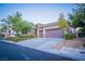 Beautiful single story home with desert landscaping, two car garage, and neutral color palette at 10391 Avebury Manor Ln, Las Vegas, NV 89135