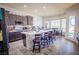 Open concept kitchen with a center island, barstool seating, and stainless steel appliances at 10391 Avebury Manor Ln, Las Vegas, NV 89135