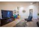 Spacious living room featuring wood-look floors and a stylish slate coffee table at 10391 Avebury Manor Ln, Las Vegas, NV 89135