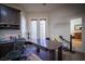 Home office with hardwood floors, custom shelving, and a ceiling fan at 10391 Avebury Manor Ln, Las Vegas, NV 89135