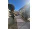 An inviting backyard area with decorative shrubs and a cozy fire pit for outdoor enjoyment at 10548 Ettenmoor Ave, Las Vegas, NV 89135