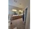 Bright bathroom featuring a double vanity with ample counter space and storage at 10548 Ettenmoor Ave, Las Vegas, NV 89135