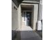 Inviting front entrance with a textured stucco facade and decorative glass block window at 10548 Ettenmoor Ave, Las Vegas, NV 89135