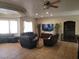 Spacious living room with tile flooring, recessed lighting, and comfortable seating arrangement at 10548 Ettenmoor Ave, Las Vegas, NV 89135