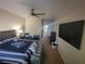 Comfortable main bedroom boasting neutral walls, soft natural light, and ceiling fan at 10548 Ettenmoor Ave, Las Vegas, NV 89135
