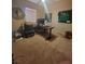 Functional office space with neutral walls, and ceiling fan offers productivity and comfort at 10548 Ettenmoor Ave, Las Vegas, NV 89135