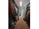 Spacious walk-in closet with shelving and hanging racks for ample storage at 10548 Ettenmoor Ave, Las Vegas, NV 89135