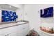 Bright bathroom featuring a granite countertop and dinosaur-themed shower curtain at 1125 Meadow Sparrow Pl, Henderson, NV 89011