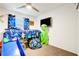 bedroom with a blue bunkbed, alien decor and blue curtains at 1125 Meadow Sparrow Pl, Henderson, NV 89011