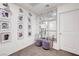 Bright upstairs hallway featuring a mirrored wall, console table and two ottomans at 1125 Meadow Sparrow Pl, Henderson, NV 89011