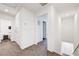 Upstairs hallway with carpet, white walls and doors to different rooms at 1125 Meadow Sparrow Pl, Henderson, NV 89011