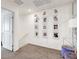 Bright upstairs hallway with recessed lighting and framed photos on the wall at 1125 Meadow Sparrow Pl, Henderson, NV 89011