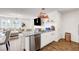 Open-concept kitchen with granite island and seamless flow to the living room area at 1125 Meadow Sparrow Pl, Henderson, NV 89011