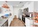 Contemporary kitchen with stainless steel appliances, granite countertops, and hardwood flooring at 1125 Meadow Sparrow Pl, Henderson, NV 89011