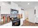 Modern kitchen featuring stainless appliances, granite countertops, and tile backsplash at 1125 Meadow Sparrow Pl, Henderson, NV 89011