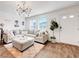 Bright living room with stylish furnishings, modern lighting, and a cozy atmosphere at 1125 Meadow Sparrow Pl, Henderson, NV 89011