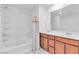 Bright bathroom with double sinks, spacious vanity, and bathtub with shower at 1145 Belton Lake Ave, North Las Vegas, NV 89086