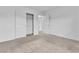 Carpeted bedroom with closet and two doors for easy access and storage at 1145 Belton Lake Ave, North Las Vegas, NV 89086