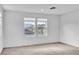 Bright bedroom with two windows and neutral carpet offers a serene space at 1145 Belton Lake Ave, North Las Vegas, NV 89086