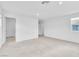 Bright bedroom features neutral carpet, white walls, and a window for natural light at 1145 Belton Lake Ave, North Las Vegas, NV 89086