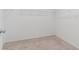 Walk-in closet with white wire shelving, beige carpeting, and neutral paint at 1145 Belton Lake Ave, North Las Vegas, NV 89086