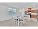 Dining area with a table, chairs, and plenty of natural light from surrounding windows at 1145 Belton Lake Ave, North Las Vegas, NV 89086