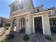 Charming two-story home featuring arched entryways and desert landscaping at 1145 Belton Lake Ave, North Las Vegas, NV 89086