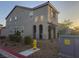 Two story home with a yellow fire hydrant and an electrical box at 1145 Belton Lake Ave, North Las Vegas, NV 89086