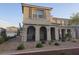 Charming two-story home featuring arched entryways and desert landscaping at 1145 Belton Lake Ave, North Las Vegas, NV 89086