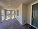 Inviting covered front porch with brick pavers and an arched entryway, enhancing curb appeal at 1145 Belton Lake Ave, North Las Vegas, NV 89086