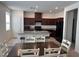 Open kitchen features a center island with bar seating, and a dining area at 1145 Belton Lake Ave, North Las Vegas, NV 89086