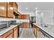 Well-equipped kitchen with granite countertops, stainless steel appliances, and tile flooring at 1145 Belton Lake Ave, North Las Vegas, NV 89086