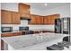 Kitchen with granite countertops, stainless steel appliances, and ample cabinet space at 1145 Belton Lake Ave, North Las Vegas, NV 89086