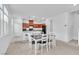 Kitchen and dining area feature modern appliances and an island with bar seating at 1145 Belton Lake Ave, North Las Vegas, NV 89086