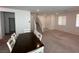 Spacious living room with adjoining dining area and staircase at 1145 Belton Lake Ave, North Las Vegas, NV 89086