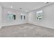 Bright living room featuring recessed lighting, neutral carpet, and multiple windows at 1145 Belton Lake Ave, North Las Vegas, NV 89086