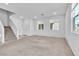Inviting living area with stairs, front door, and plenty of natural light from windows at 1145 Belton Lake Ave, North Las Vegas, NV 89086