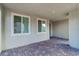 Covered patio with brick flooring, providing a comfortable outdoor living space with natural light at 1145 Belton Lake Ave, North Las Vegas, NV 89086
