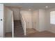 Bright interior featuring staircase and neutral-colored walls at 1145 Belton Lake Ave, North Las Vegas, NV 89086