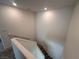 Bright stairway with carpeted steps and white handrails, connecting different levels at 1145 Belton Lake Ave, North Las Vegas, NV 89086