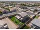 Aerial shot of the home with a private backyard, lush artificial turf, and a patio, nestled in a gated community at 1297 Ventura Cliffs Ave, Henderson, NV 89012